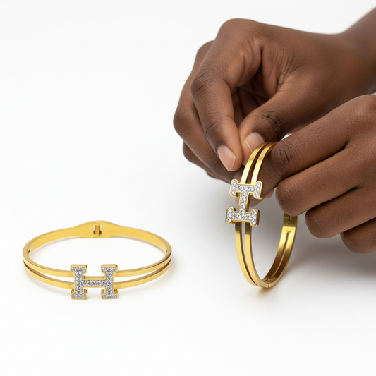 Bracelet Hermès clic H argenté sur support